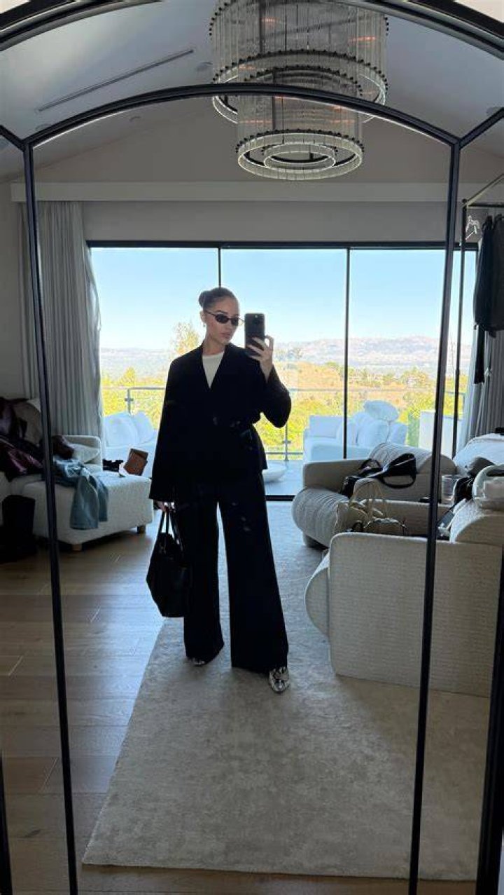 Dressed down:&nbsp;The star dressed casually for the catch up, donning a black shirt with a white logo that read 'keep it simple' on one side
